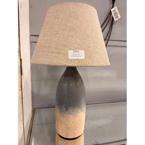 3242 - A small lava style table lamp