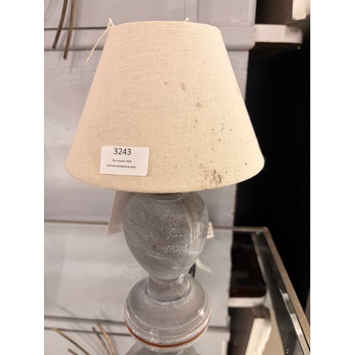 3243 - A small stone style table lamp