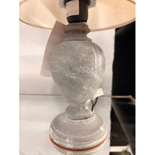 3243 - A small stone style table lamp