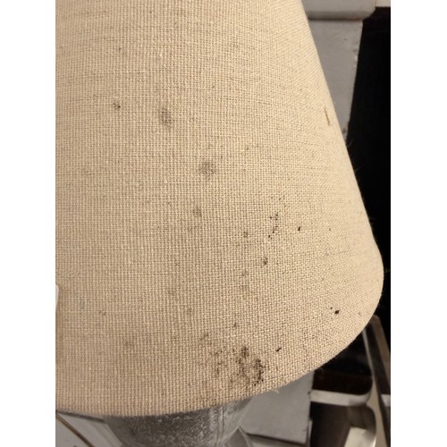 3243 - A small stone style table lamp