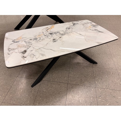 3275 - An Aura ceramic coffee table with iron legs * This lot is subject to VAT