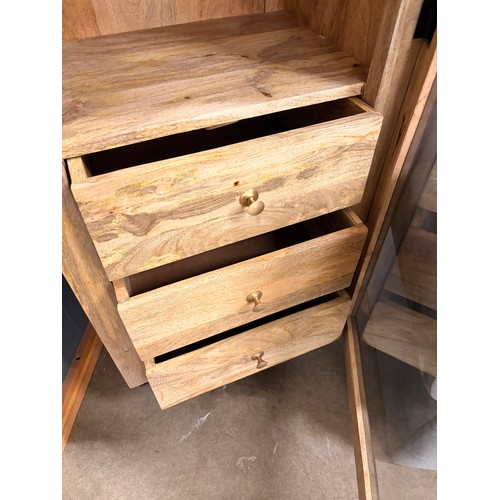 3284 - An Atomic black single door mango wood and glass cabinet    * This lot is subject to VAT