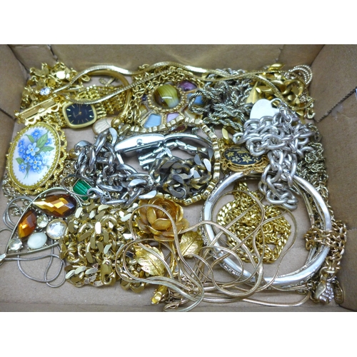 2021 - A collection of costume jewellery, mainly gold tone, and three lady’s wristwatches