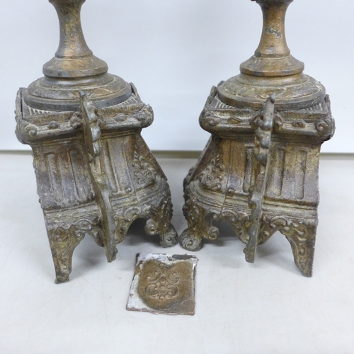 2033 - A pair of metal ornate candlesticks, 20cm
