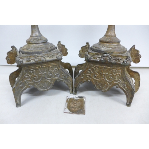 2033 - A pair of metal ornate candlesticks, 20cm