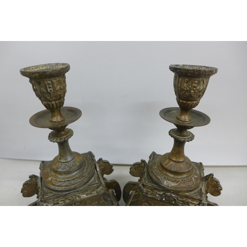 2033 - A pair of metal ornate candlesticks, 20cm