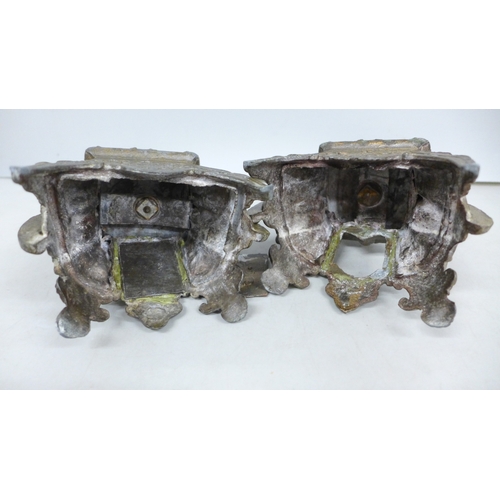 2033 - A pair of metal ornate candlesticks, 20cm