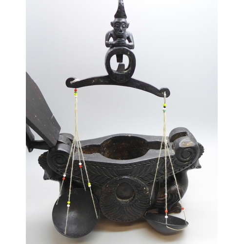 2039 - A set of Eastern opium scales housed in carved wooden box with hinged lid and bird detail, 17cm wide