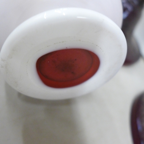 2050D - A pair of red glass lustre vases, missing drops, a Bohemian ruby glass vase and a Ruby decanter, no ... 