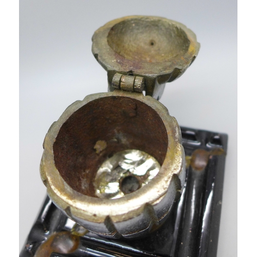 2051 - A Great War Memento hand grenade casting on a stand, (stand a/f)