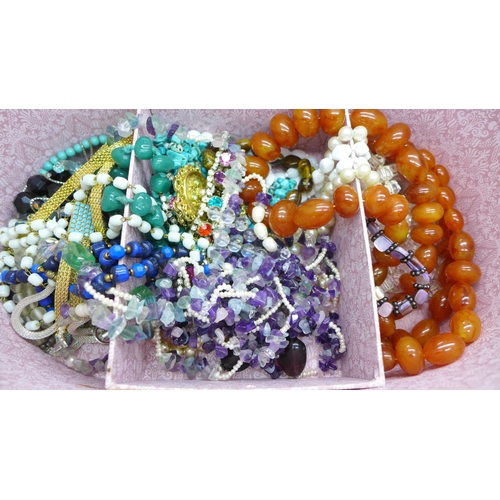 2059 - A case of costume jewellery including bead jewellery including amethyst quartz, tigers eye bracelet,... 