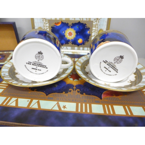 2066 - A collection of Royal Worcester 'To Celebrate The Millennium 2000AD' china, large plate, two trios, ... 
