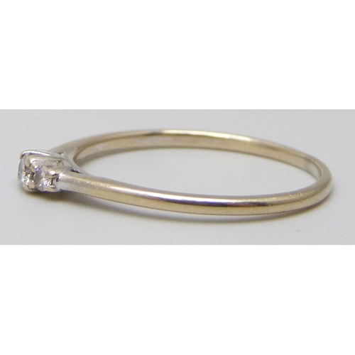 7029 - A white metal three stone diamond ring, 1.2g, N