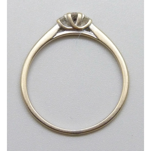 7029 - A white metal three stone diamond ring, 1.2g, N