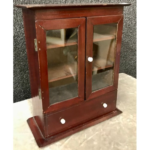 259 - A miniature mahogany table top cabinet