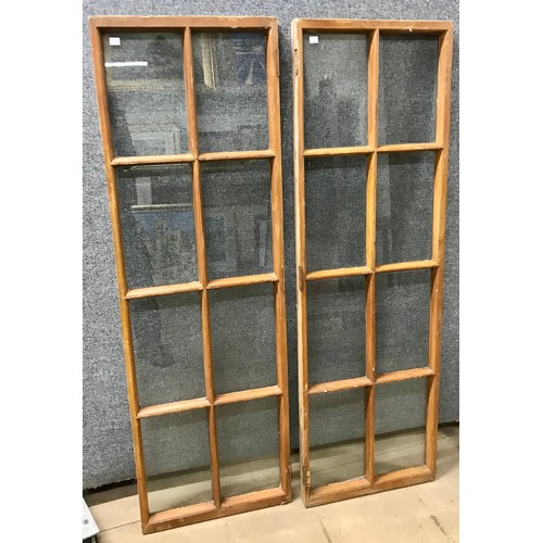 264 - A pair of French pine and glass shutters