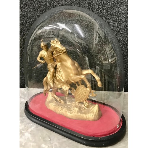 277 - A gilt figure of a soldier on horseback in a Victorian glass dome case