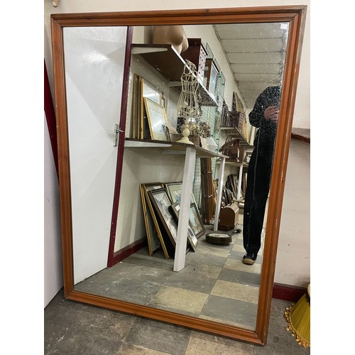 288 - A large stained pine mirror