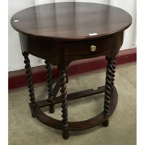 167 - An early 20th Century oak barleytwist demi-lune gateleg side table