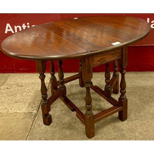 114 - An 18th Century style Old Charm oak gateleg occasional table