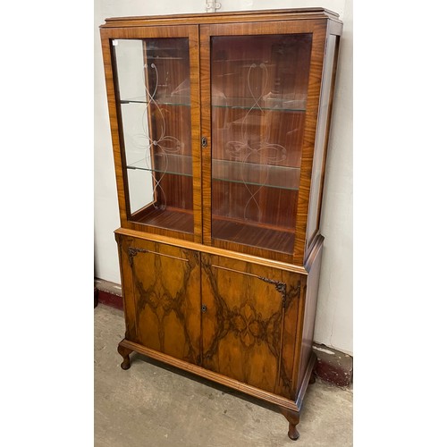 86C - A Queen Anne style walnut display cabinet