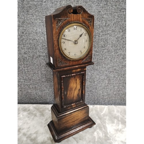 260A - An oak miniture longcase clock
