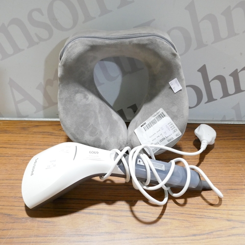 6069 - A Philips handheld steamer and an Airia Living memory foam travel pillow  (378-90,304) *This lot is ... 