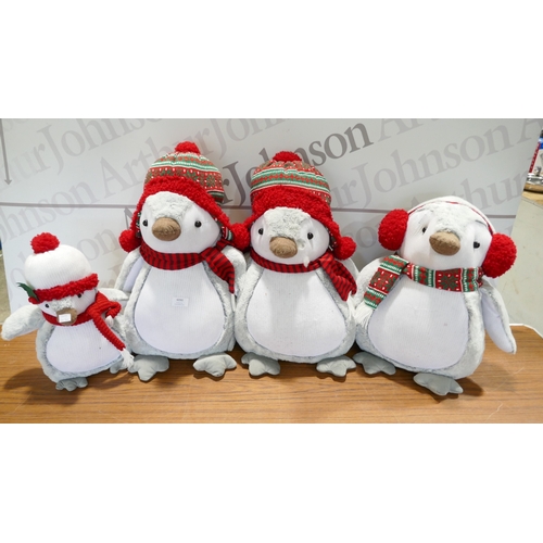 6090 - Four Christmas penguins, (378-268) *This lot is subject to VAT