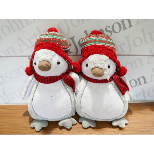 6090 - Four Christmas penguins, (378-268) *This lot is subject to VAT