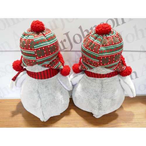 6090 - Four Christmas penguins, (378-268) *This lot is subject to VAT