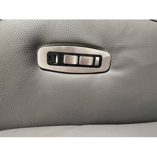 3003 - A dark grey leather electric reclining swivel chair