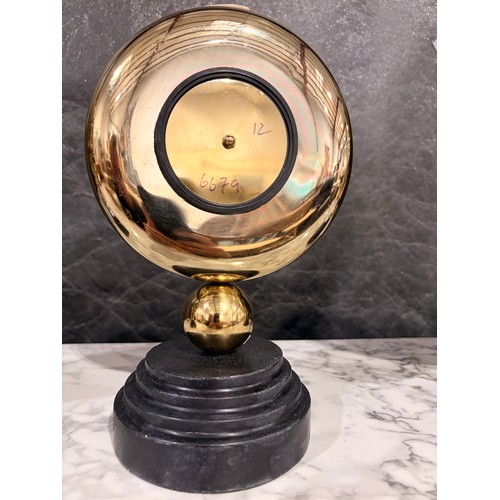 3008 - A Minster gold effect mantle clock on a circular black marble base