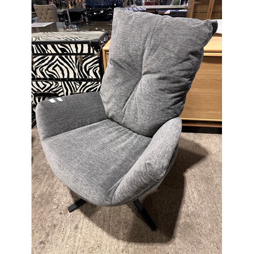 3012 - A grey fabric swivel/rocking chair with footstool