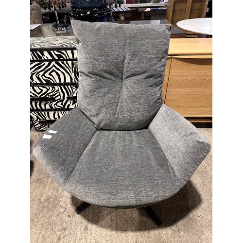 3012 - A grey fabric swivel/rocking chair with footstool