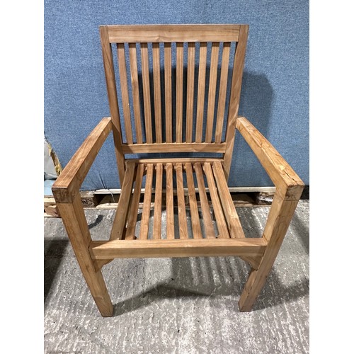 3040 - A teak circular folding garden table and a pair of teak carver chairs