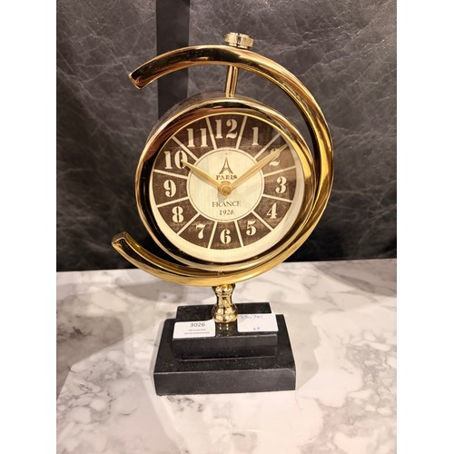 3049 - A gold effect ‘Paris’ mantle clock with a black marble base