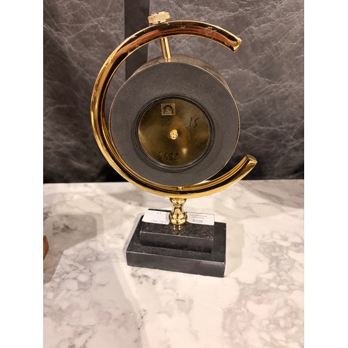 3049 - A gold effect ‘Paris’ mantle clock with a black marble base