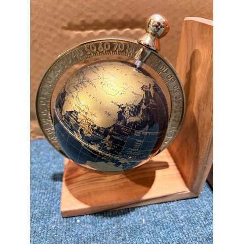 3054 - A pair of black and gold effect globe bookends