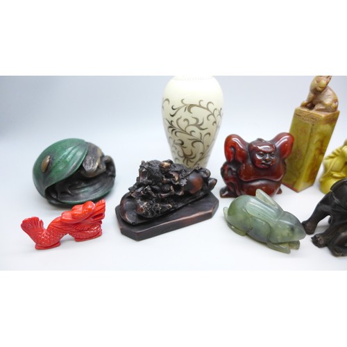 2192 - A collection of oriental items to include carved hardstone seal, carved Japanese amber netsuke of a ... 