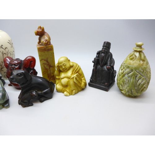 2192 - A collection of oriental items to include carved hardstone seal, carved Japanese amber netsuke of a ... 