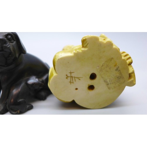 2192 - A collection of oriental items to include carved hardstone seal, carved Japanese amber netsuke of a ... 