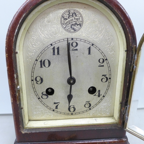 2031 - A German beehive 8-day mantel clock with striking movement and bevelled glass front, marked Tempus F... 