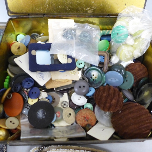 2033 - Two beaded evening bags and a tin of buttons