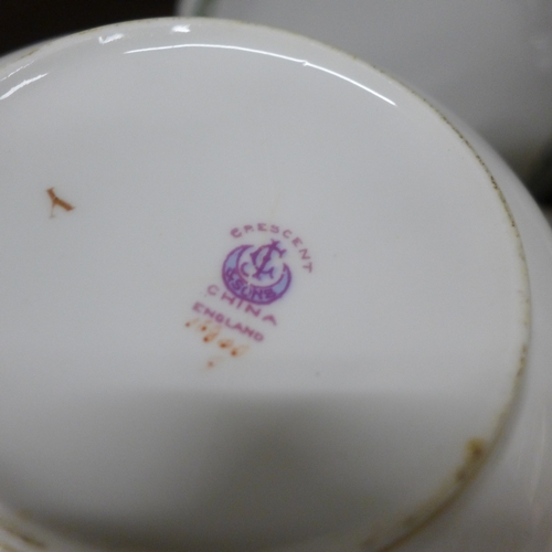 2055 - A George Jones and Sons 'Crescent' tea service with green ivy banded decoration, 10x tea cups, 12x s... 