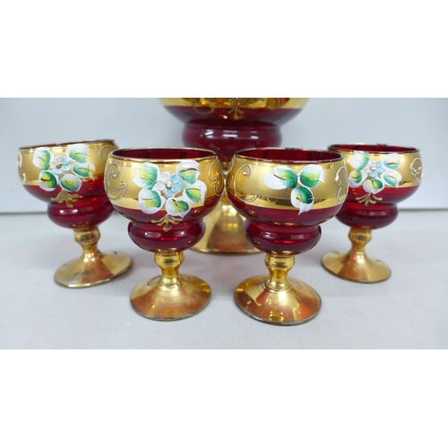 2060 - A Bohemian red glass and gilt decanter and four glasses