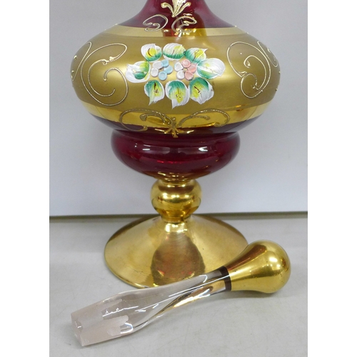 2060 - A Bohemian red glass and gilt decanter and four glasses