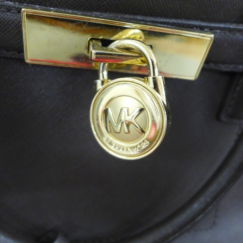 2137 - A Michael Kors handbag, a/f, lining requires cleaning, a Ted Baker handbag, a Ted Baker wallet and a... 