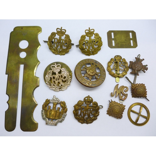 2170 - A collection of military cap badges, and a button polishing guard