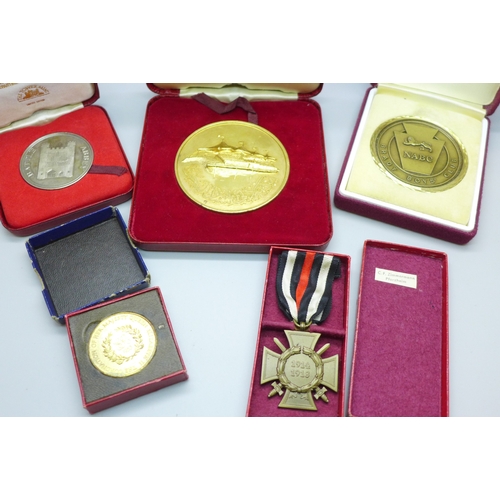 2180 - A 1953 Coronation medallion, a camel racing medallion, two other medallions and a replica medal, all... 
