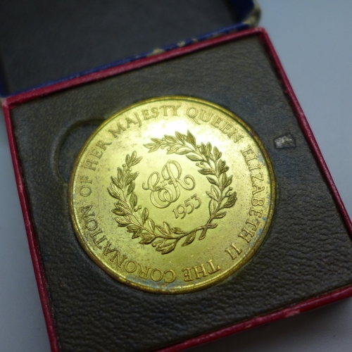 2180 - A 1953 Coronation medallion, a camel racing medallion, two other medallions and a replica medal, all... 
